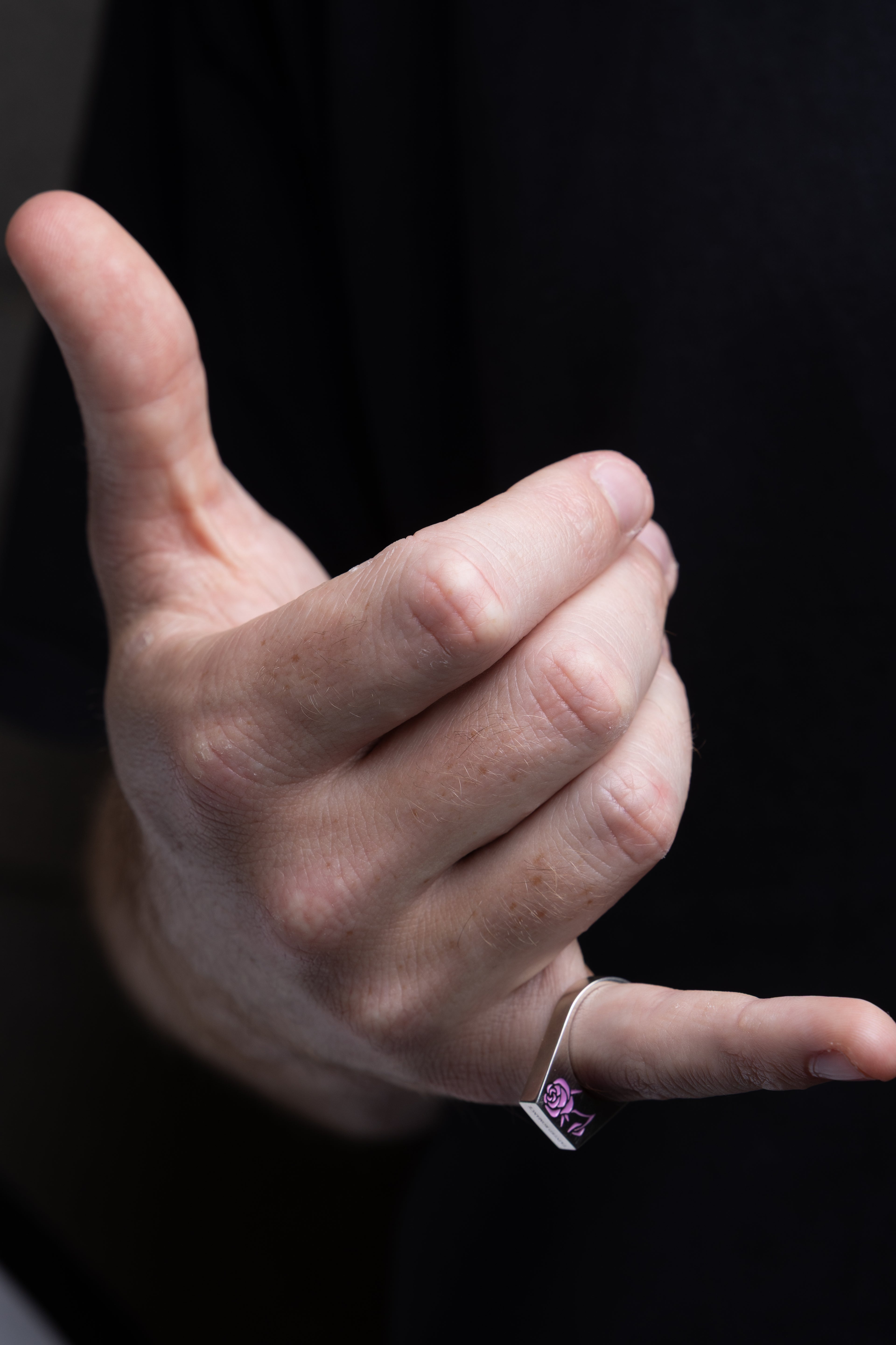 Silver stamp ring with a pink rose cold enamel
