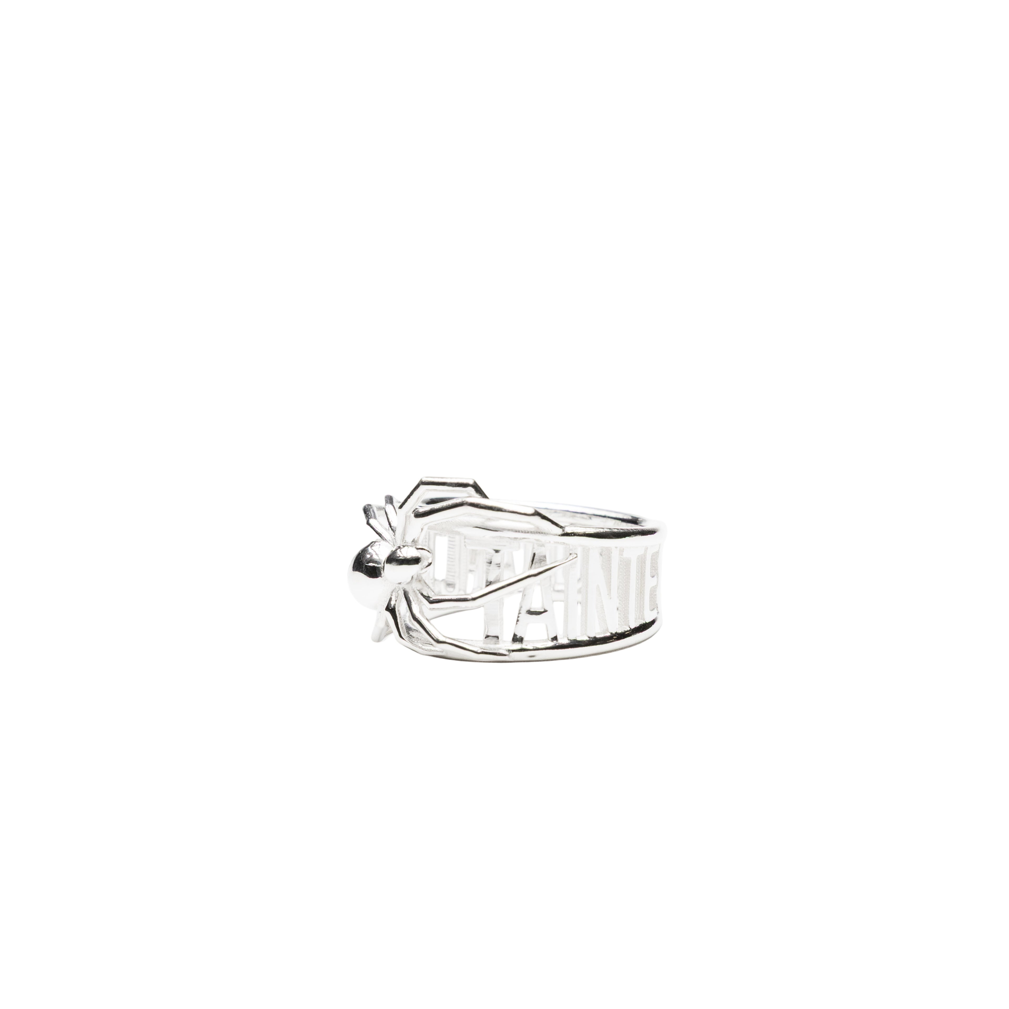 Silver ring features an intricately detailed 3D spider crawling across
